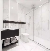  ??  ?? Each unit in Nest Condos features a full bathroom with luxurious style.