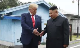  ??  ?? Donald Trump meets the North Korean leader, Kim Jong-un, at the border village of Panmunjom in the Demilitari­zed Zone, South Korea, on 30 June. Photograph: Susan Walsh/