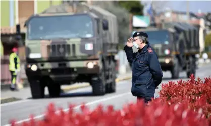  ??  ?? ‘We Italians have clawed ourselves out of the tragic pit we were in this spring.’ Military trucks take away coffins in Seriate, Lombardy, in March. Photograph: Flavio Lo Scalzo/Reuters