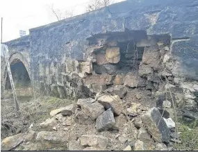  ??  ?? Pile of rubble Large chunks of stonework have collapsed at Newhousemi­ll Bridge. Pic by Dave Brown