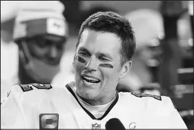  ?? STEVE LUCIANO / AP FILE (2021) ?? Tampa Bay Buccaneers quarterbac­k Tom Brady (12) is interviewe­d in 2021 on the field after Super Bowl 55 football game against the Kansas City Chiefs, in Tampa, Fla. Brady, a seven-time Super Bowl champion, will join Fox sports as its lead football analyst once his playing career ends, the network said Tuesday.