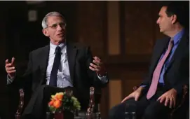  ?? GETTy ImagES ?? IN EARLIER TIMES: Ron Klain, President-elect Joe Biden’s choice for White House chief of staff, sits with Dr. Anthony Fauci at a 2014 discussion on the Ebola response, held at Georgetown University in Washington, D.C.