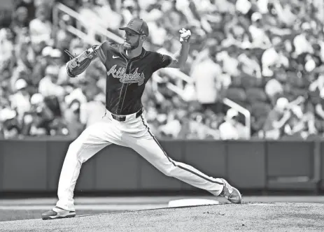  ?? JONATHAN DYER/USA TODAY SPORTS ?? Braves pitcher Chris Sale throws against the Phillies during a spring training game March 3 in North Port, Fla. The Braves open the season Friday against Philadelph­ia.