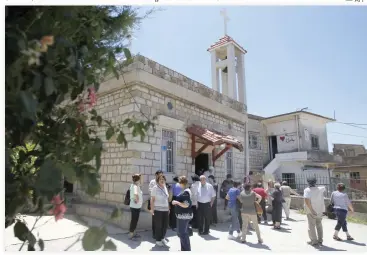  ??  ?? Christians attend mass at a church in the Druze village of Ein Qiniye in the occupied Golan Heights in this June 11 photo. (AFP)