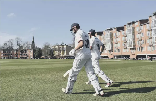  ??  ?? 0 Sir Alastair Cook, right, and Nick Browne make their way out to bat for Essex on the first morning of the first class match against Cambridge MCCU at Fenner’s.