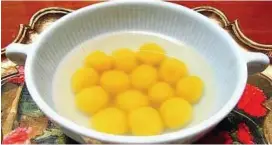  ??  ?? The writer sprang a sweet surprise on her family with her kabocha tang yuan (glutinous rice balls made with Japanese pumpkin).