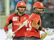  ??  ?? Hong Kong's Nizakat Khan (left) and Anshuman Rath run between the wickets