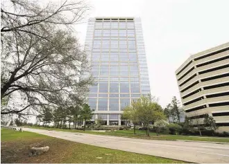  ?? Gary Coronado / Houston Chronicle ?? Anadarko’s corporate towers stand tall over the entrance to The Woodlands, and it sent major shockwaves across the region last week when the oil company announced its was cutting 1,000 jobs, or 17 percent of its workforce.