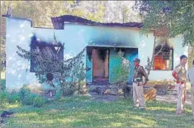  ?? ANI ?? Police stand guard near the area where the firing took place, at Mukroh, in West Jaintia Hills.
