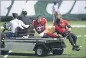  ?? BILL KOSTROUN — THE ASSOCIATED PRESS ?? San Francisco 49ers defensive end Nick Bosa (97) is carted off the field after being injured during the first half against the New York Jets, Sunday, in East Rutherford, N.J.