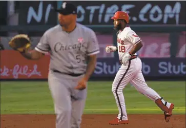  ?? Victor Decolongon Getty Images ?? THE ANGELS’ Brian Goodwin rounds the bases after homering against Chicago White Sox pitcher Hector Santiago (53) in the second inning. Goodwin’s bases-loaded walk in the seventh proved to be the winning run.