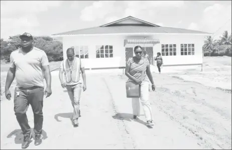  ?? (DPI photo) ?? Minister of Education Nicolette Henry (right) visiting one of the schools on Saturday