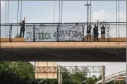  ?? MARK MULLIGAN / HOUSTON CHRONICLE VIA AP ?? Members of #TeamVaness­a and FIEL Houston demand justice Wednesday for slain Army Spc. Vanessa Guillen in Houston.
