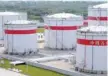  ?? — Reuters ?? Oil tanks are seen at a Sinopec plant in Hefei, China.