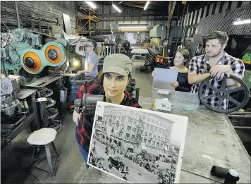  ?? MARK VAN MANEN/PNG ?? Madeleine Grant displays a 1939 photograph showing a Royal visit of her family’s Main Sheet Metal Works along with her bother Alex and sister Evelyn, back right. The longtime family-owned business has closed.