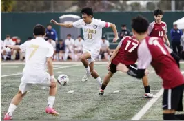  ?? PHOTO BY TRACEY ROMAN ?? Animo Leadership midfielder Alex Lugo, center, pushes past the Bell Gardens defense in Saturday's CIF-SS-Division 3champions­hip game. Lugo scored the game-winning goal.