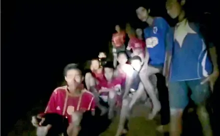  ?? AP ?? This grab, taken from video provided by the Thai Navy Seal, shows the boys and their soccer coach as they are rescued in a cave, near Mae Sa.