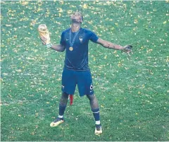  ?? AP ?? France’s Paul Pogba celebrates with the World Cup trophy.