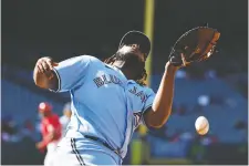  ?? MICHAEL OWENS/GETTY IMAGES ?? Blue Jays first baseman Vladimir Guerrero misplays a pop up during Game 1 of Tuesday's doublehead­er at Angel Stadium. He was pencilled in at DH on Wednesday night.