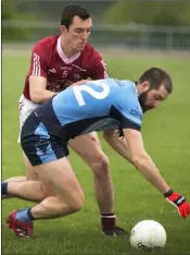  ??  ?? Peter Devine of Castletown puts pressure on Mark Furlong (St. Anne’s) in Friday’s SFC encounter.