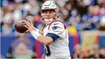  ?? Adam Hunger/Associated Press ?? New England Patriots quarterbac­k Mac Jones passes against the New York Giants on Nov. 26 in East Rutherford, N.J.
