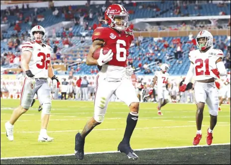  ?? ( Kevin C. Cox/ Getty Images/ TNS) ?? DeVonta Smith # 6 of the Alabama Crimson Tide rushes for a 42 yard touchdown during the second quarter of the College Football Playoff National Championsh­ip game against the Ohio State Buckeyes at Hard Rock Stadium on Jan. 11, 2021 in Miami Gardens, Florida.