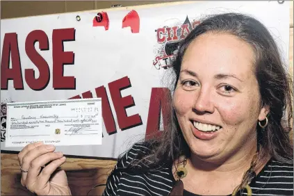  ?? JOE GIBBONS/THE TELEGRAM ?? She didn’t win the Chase the Ace jackpot of $962,995, but Courtney Noseworthy of Bay Roberts walked away with a consolatio­n prize cheque for $172,368 for picking the 6 of clubs at St. Kevin’s Parish Hall in Goulds on Wednesday night. There are now 11...