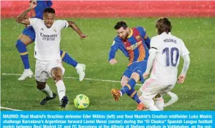  ??  ?? MADRID: Real Madrid’s Brazilian defender Eder Militao (left) and Real Madrid’s Croatian midfielder Luka Modric challenge Barcelona’s Argentinia­n forward Lionel Messi (center) during the “El Clasico” Spanish League football match between Real Madrid CF and FC Barcelona at the Alfredo di Stefano stadium in Valdebebas, on the outskirts of Madrid on Saturday. — AFP