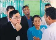  ?? AFP ?? Myanmar social welfare minister Win Myat Aye (left) talks to Rohingya refugees at the Kutupalong refugee camp.