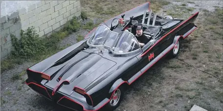  ?? Mark Racop Fiberglass Freaks ?? MARK RACOP, a soft-spoken pastor and owner of Fiberglass Freaks in Logansport, Ind., sits in one of his custom-made Batmobiles.