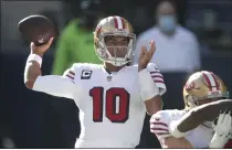  ?? SCOTT EKLUND — THE ASSOCIATED PRESS, FILE ?? The 49ers’ brass has backed quarterbac­k Jimmy Garoppolo, above, the past two offseasons, despite looking around at other options.