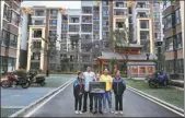  ?? TIAN JIAN / FOR CHINA DAILY ?? On August 5, 2018, Yang Zhenghao’s family poses in front of the old house in Pingcha village, Sansui county, Guizhou. TIAN JIAN / FOR CHINA DAILY; on June 15, 2019, in Sansui county, Yang Zhenghao and his family take a photo in front of the resettleme­nt community.