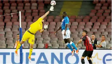  ??  ?? AC Milan’s Gianluigi Donnarumma (left) in action with Napoli’s Kalidou Koulibaly during the Italian Serie A match at Stadio San Paolo in Naples, Italy in this Aug 25 file photo. — Reuters photo