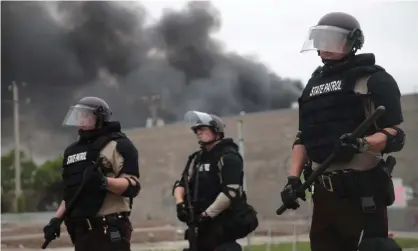  ?? Photograph: Scott Olson/Getty Images ?? Police hold a line on the fourth day of protests in Minneapoli­s.