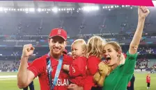  ?? ANI ?? England captain Jos Buttler with his family celebrate during the presentati­on ceremony after winning the T20 World Cup 2022 final yesterday.