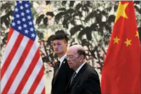  ?? ANDY WONG — THE ASSOCIATED PRESS ?? U.S. Commerce Secretary Wilbur Ross arrives to the Diaoyutai State Guesthouse to attend a meeting with Chinese Vice Premier Liu He in Beijing, Sunday. U.S. Commerce Secretary Ross is in Beijing for talks on China’s promise to buy more American goods...