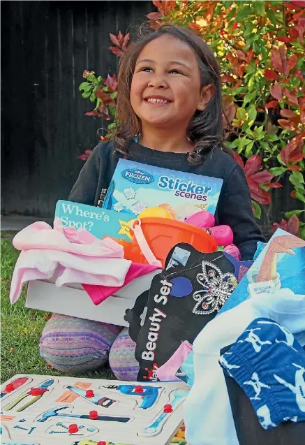  ??  ?? Siena-Rose Shelford is hoping to give less fortunate children a merry Christmas this year with her shoebox.