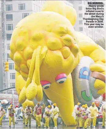  ??  ?? BIG BRRRRD: Heavy winds force Big Bird’s inflated nose to the street during the Macy’s Thanksgivi­ng Day Parade in 2006. This year may be even windier.