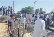  ?? HT PHOTO ?? Protesters at the Ramayan railway station block the railway crossing on Sunday.