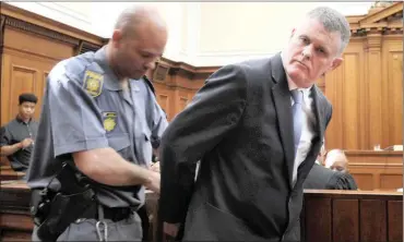  ?? ARMAND HOUGH African News Agency (ANA) ?? Former property mogul Jason Rohde is handcuffed after being sentenced to 20 years behind bars for murdering and staging the suicide of his wife Susan. Rohde learned his fate when Western Cape High Court Judge Gayaat Salie-Hlophe sentenced him. His family also attended the proceeding­s. |