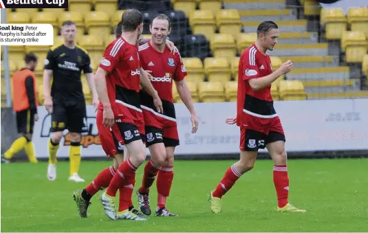  ??  ?? Goal king Peter Murphy is hailed after his stunning strike