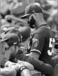  ?? DARRON CUMMINGS/AP ?? Pitcher Mike Fiers steps into the dugout during Sunday’s spring training game.