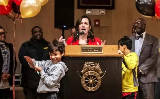  ?? Michael M. Santiago/Post-Gazette ?? Allegheny County Controller Chelsa Wagner, surrounded by her family, speaks to supporters during her re-election campaign launch party Wednesday at the Teamster Temple in Lawrencevi­lle.