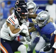  ?? DUANE BURLESON — THE ASSOCIATED PRESS ?? Chicago Bears running back David Montgomery (32) rushes during the first half of a game against the Detroit Lions earlier this year in Detroit.