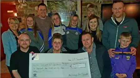  ??  ?? The staff and management of the Slaney Inn in Oylegate present a cheque for €2,430 along with parents Carol and Fergus and their son Billy.