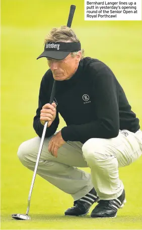  ??  ?? Bernhard Langer lines up a putt in yesterday’s opening round of the Senior Open at Royal Porthcawl