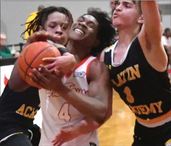  ?? CHRIS CHRISTO — BOSTON HERALD ?? Charlestow­n’s Jaylen Hunter-Coleman gets grabbed by Latin Academy’s Randiel Jimenez Fernandez as he drives to the hoop during a Boston City League boys basketball semifinal.