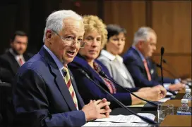  ?? MANUEL BALCE CENETA / AP ?? Washington state Insurance Commission­er Mike Kreidler and Alaska Division of Insurance Director Lori Wing-Heier join other officials testifying Wednesday during a Senate Health, Education, Labor & Pensions Committee hearing.