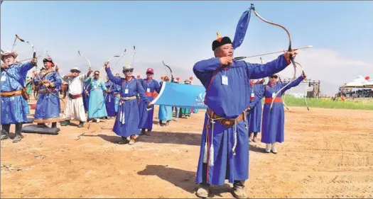  ?? PHOTOS PROVIDED TO CHINA DAILY ?? A Naadam festival in the Inner Mongolia autonomous region gathers participan­ts from different regions who showcase their archery art and eye-catching costumes; and wrestlers compete for strength and courage and young musicians play matouqin, or...
