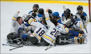  ?? SUBMITTED PHOTO ?? Team Alberta, including Medicine Hat’s Derek Whitson, celebrates after winning the Canadian Sledge Hockey Championsh­ip in Montreal Sunday.